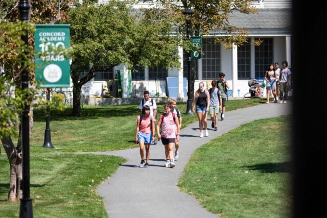 Students walking along a school campus.