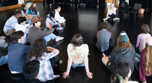 Caitlin FitzGerald ’02 speaks with current students and faculty in the dance studio on Friday morning prior to her address in the Chapel on April 19, 2024. FitzGerald was selected as this year’s Hall Fellow.