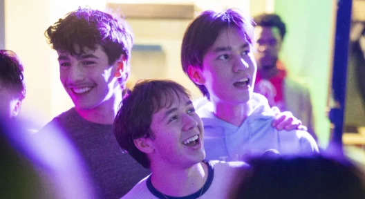 Boys socialize at the international potluck karaoke activity.