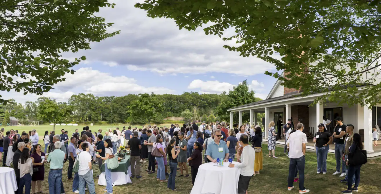 Parents meet at a social at Moriarty Athletics Campus.